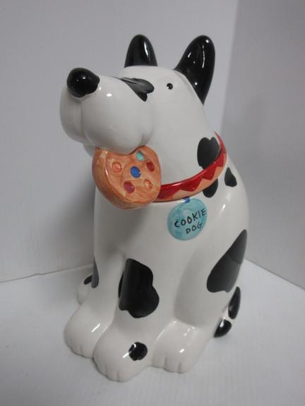 1980s Coco Dowley Dog Cookie Jar, White with Black Spots, Has a Red and Orange Dog Collar with a Blue Tag Marked "Cookie Dog", Holding a Beige Cookie with Multi-Colored Dots in His Mouth