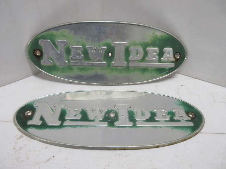 (2) Steel New Idea Signs