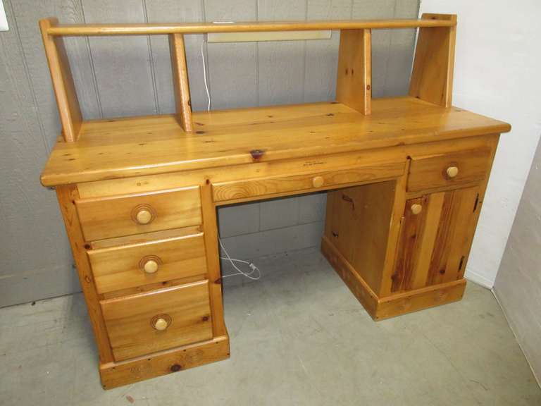 Knotty Pine Desk with Lamp Attached, Has Five Drawers and Side Cabinet Door