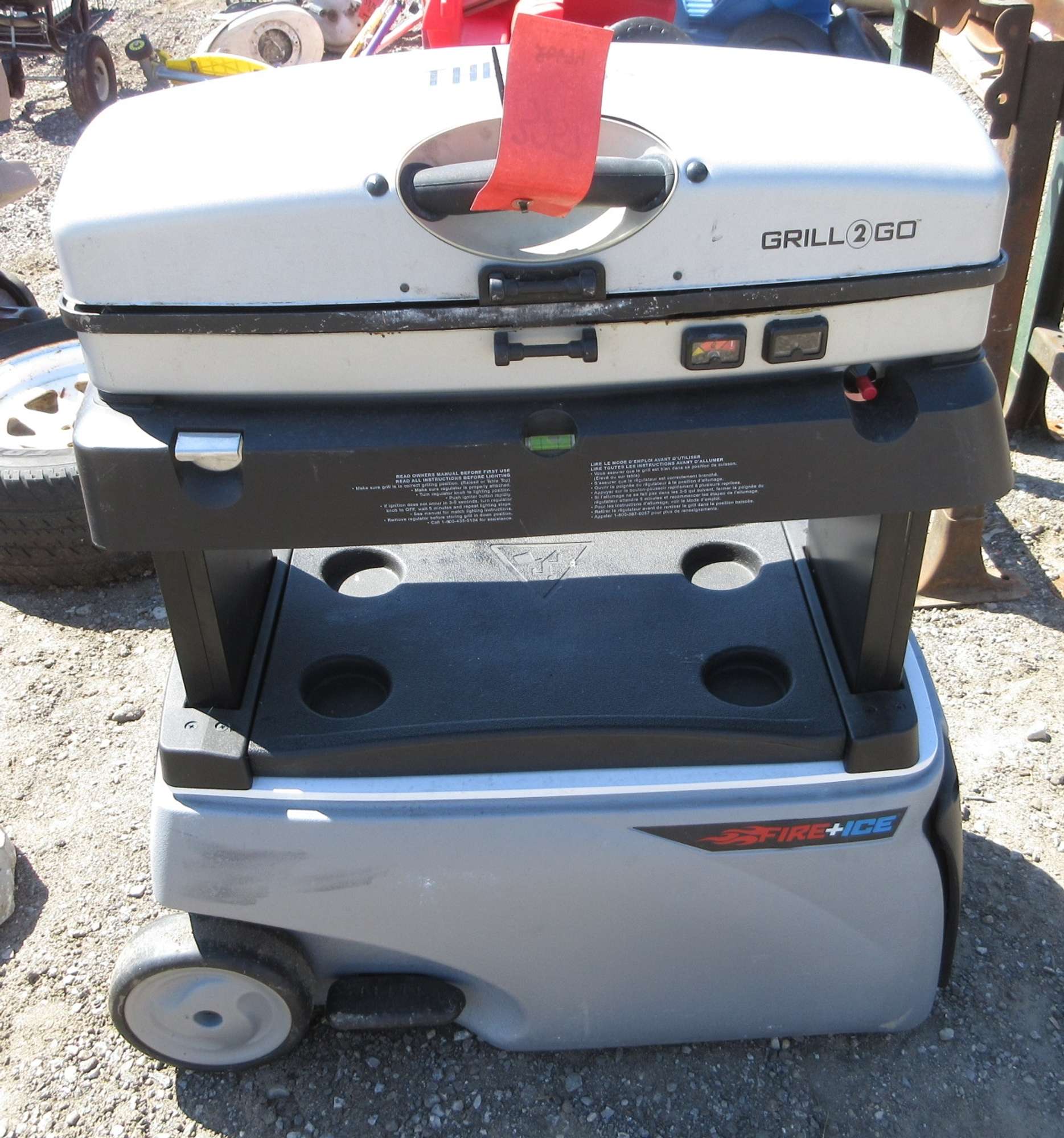 Albrecht Auctions Thermos Propane Grill Topped Rolling Cooler