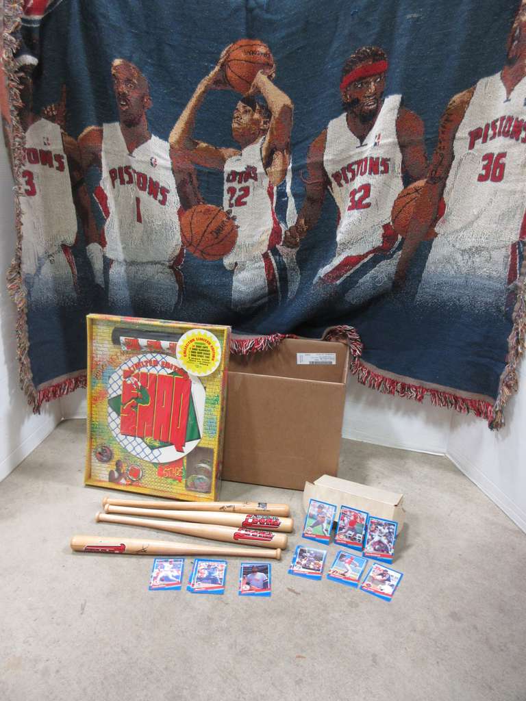 Box with Detroit Pistons Afghan, 1990 Skybox Basketball Cards, 1991 Donruss Baseball Cards, and (4) Small Baseball Bats