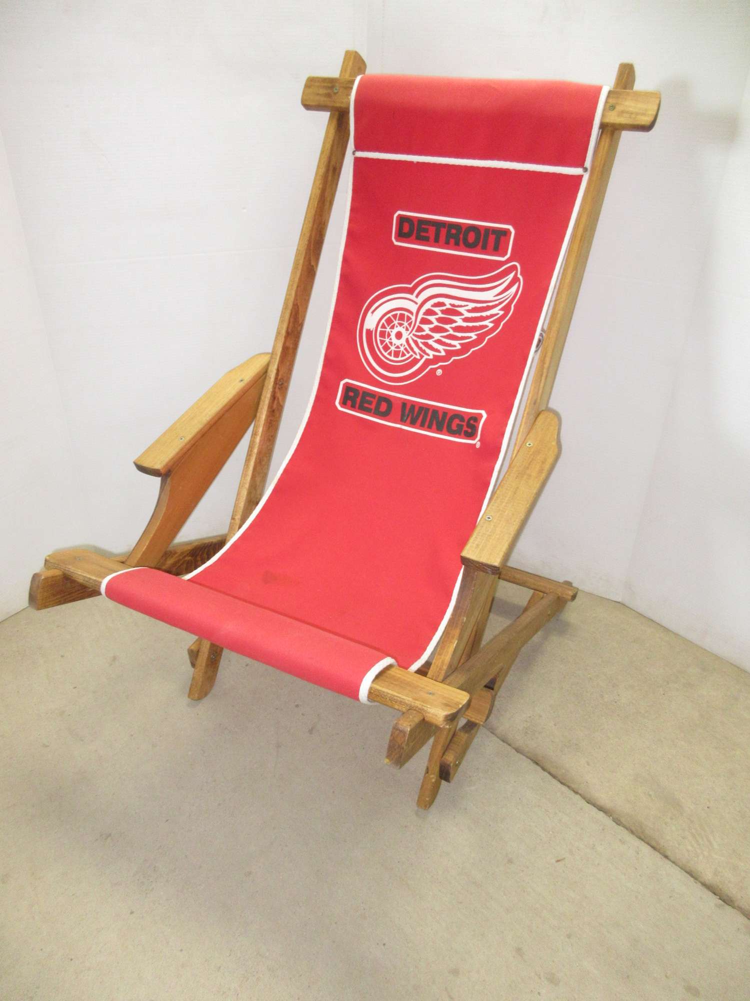 Albrecht Auctions Wood and Canvas Sling Chair with Red Wings Logo
