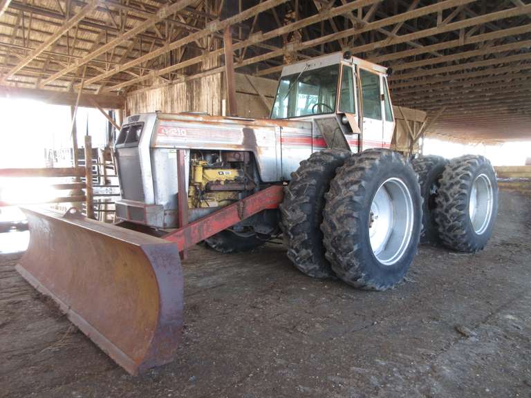 White 4-210 4x4 Tractor with 8' Shop Built Blade (Blade built by Ellis Gardner), (Approximately 10,000 Hours), Mod No. 421-82132, CAT 3208 Remanufactured Engine (Remanufacture approximately 1992), 18.4-38 Duals, 3-Point Hitch, PTO, (3)-Remote Hydraulic Outlets.  Note:  A video of this item can be viewed.  Click on the Thumbnail photo, locate the picture with the play tab, click play to watch video.