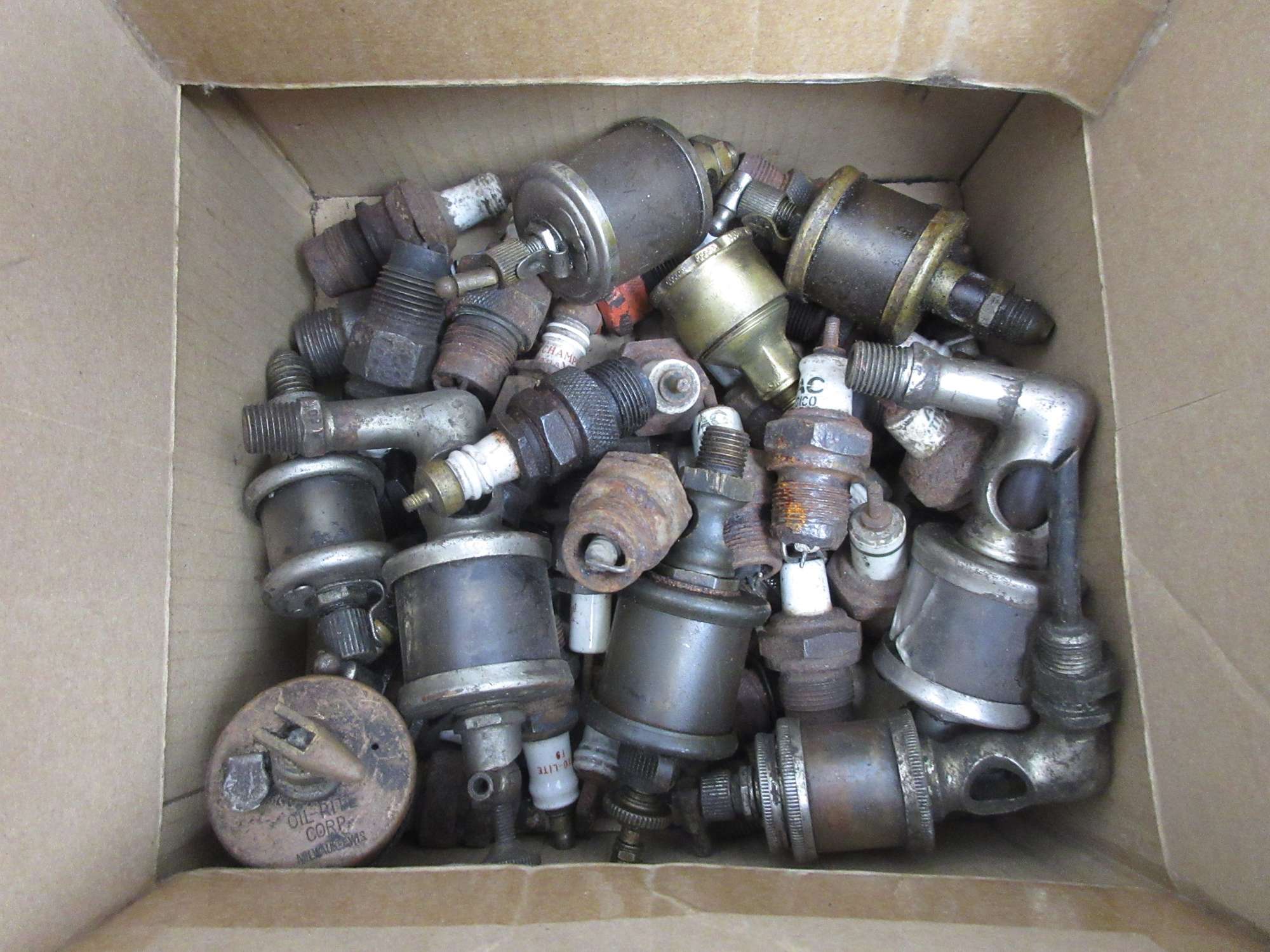 Albrecht Auctions Antique Spark Plugs and Brass Oilers
