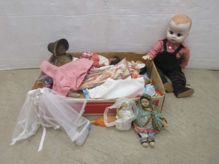 Older Dolls and Some Modern Dolls, Include: Antique Iron Doll Bank, May have been in a Fire; Doll Clothes; Baby Doll Bottles; Clothes Pins; Barbie Size Doll Shoes