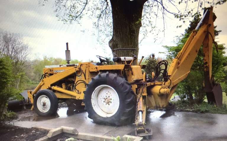 International 3114 Backhoe, 3616 Diesel, 6-Cylinder, 17' Reach, 2-Buckets (12", 30"), Front Loader, 2-Cylinder, 83" Wide, (Needs Repair of Right Rear Axle Outside Bearings, and Needs Two Batteries), Motor and All Hydraulics Work Well