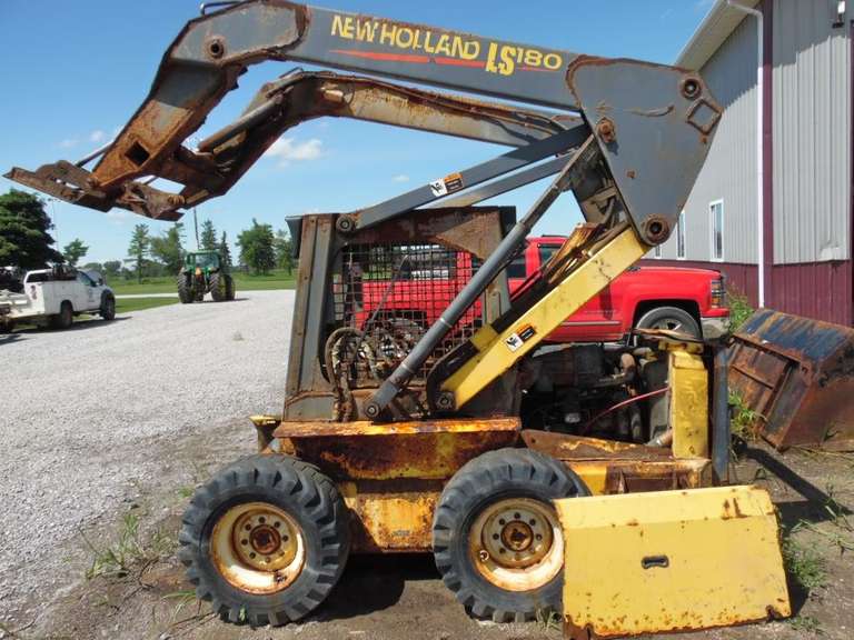 New Holland LS180 Skid Steer, Was Used to Load Fertilizer, Rusty, Runs and Operates