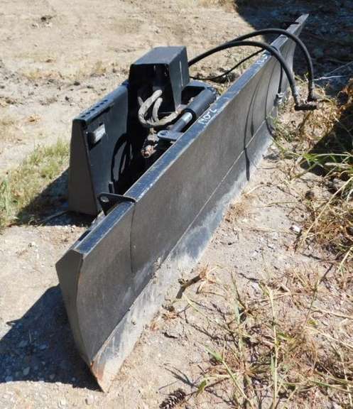 4-Way Dozer Blade for a Skid Loader