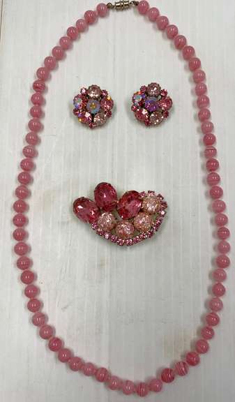 Old Hand Knotted Pink Glass Bead Necklace with Barrel Clasp, Swirled, 22 1/2"L; Pink Rhinestone Brooch with Matching Earrings, Dog Tooth Prongs on Earrings, Clip-Ons, 1"W, Brooch is 2 1/4"L with Multi Size Stones, On Back is Small Spot with Rust, Can't See While Wearing, Overall Very Good