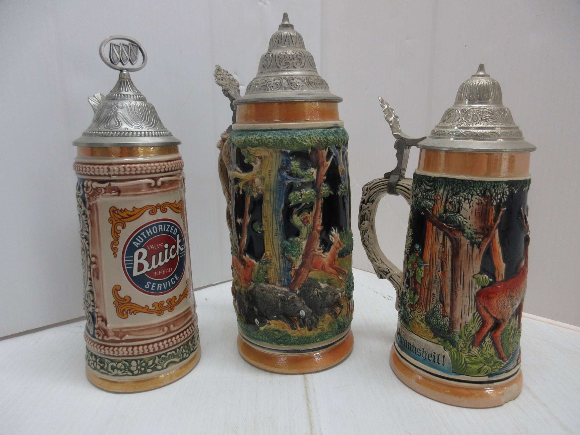 Albrecht Auctions | (3) German Beer Steins: 2- Hunting, and 1- Buick