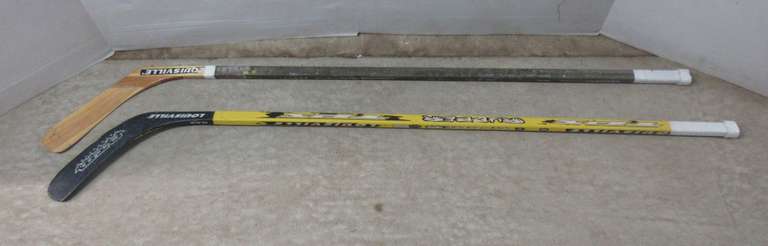 (2) Composite Hockey Stick Shafts, Blades Can be Replaced: 1- Has a Left Handed Blade in It, 1- Has a Right Handed Blade