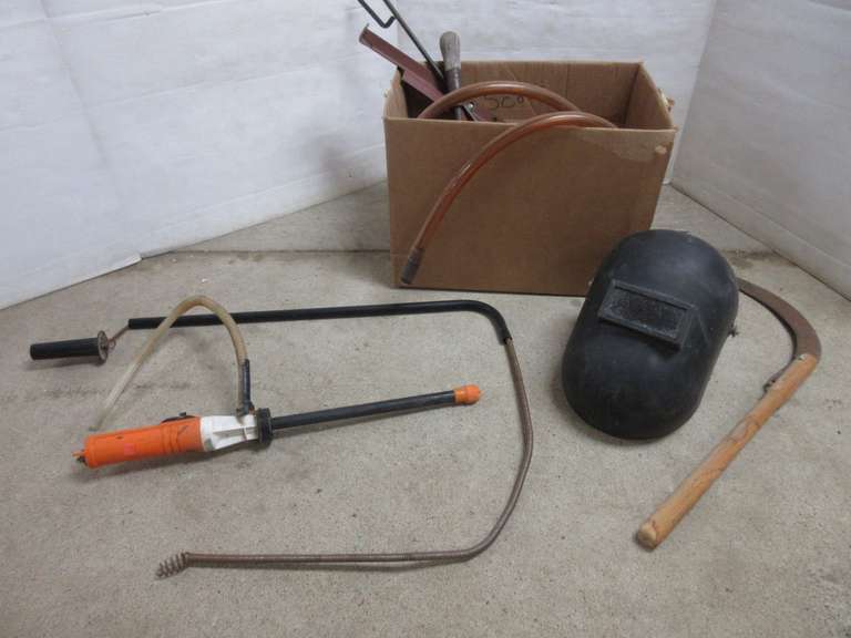 Helmet, Sickle, Drill Brace, Garden Shovel, Oil Filter Tool, Drain Snake, Siphon Hose, Skeet Shooter Frame, and More