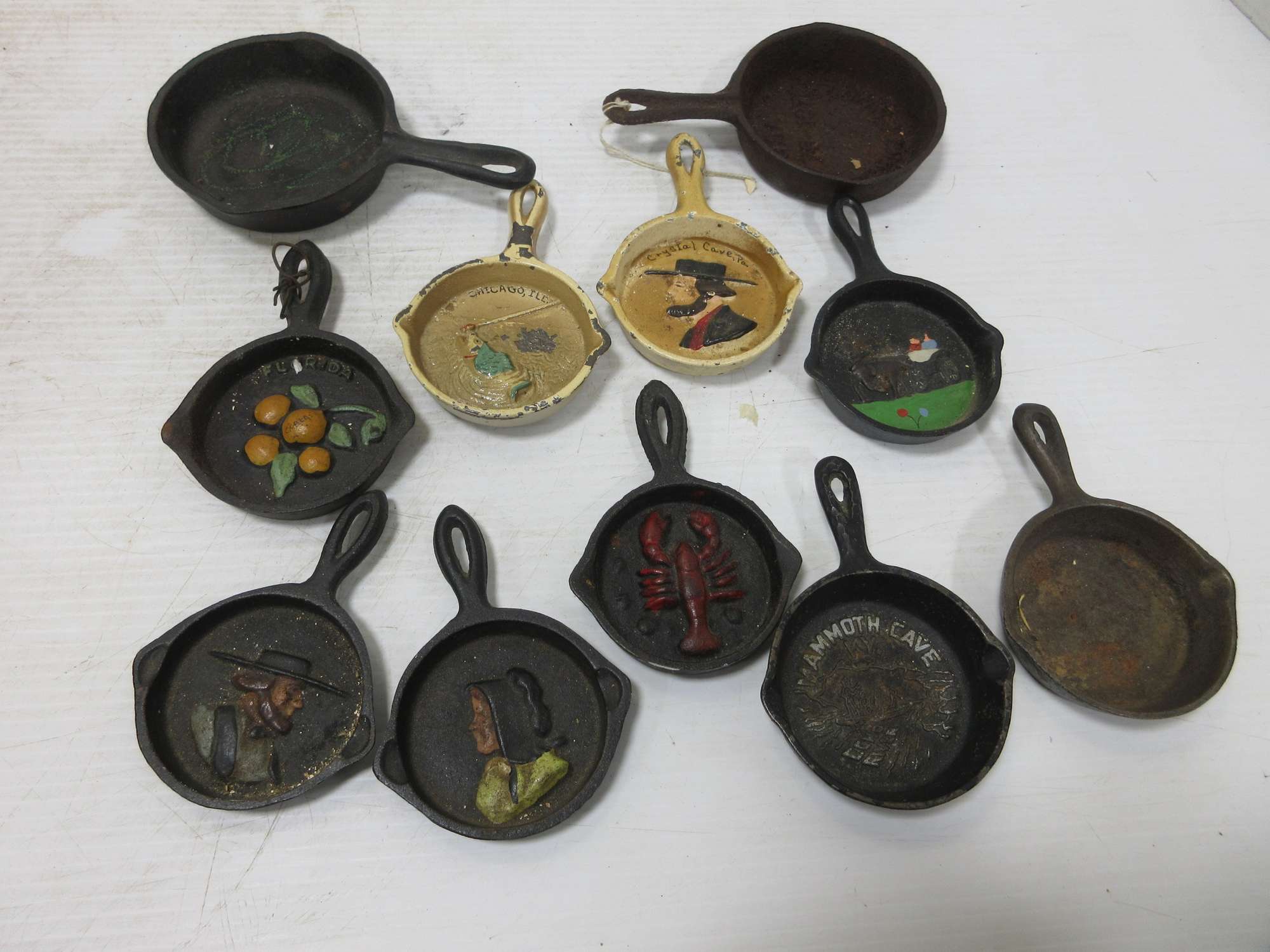 Albrecht Auctions | (11) Antique cast iron pans with amish faces, buggy