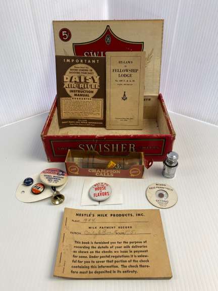 Miscellaneous items, includes: Faulk's wood call, Nestle's milk record book, Daisy air rifle instructions, car lighter, Gaines MI centennial pinback