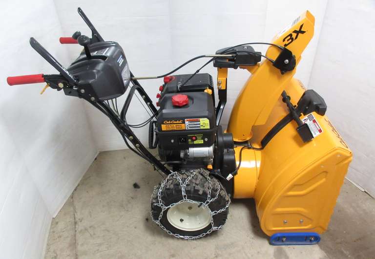 Cub Cadet snow thrower, three-stage, 28" clearing width, 357cc OHV cast iron sleeve engine, electric start, trigger control power steering, heated hand grips, 16" X-trac tires with chains, well maintained, runs great, like new, low hours, Manual in Office